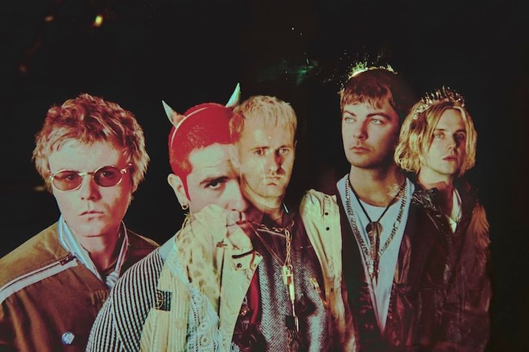 Post-punk band Fontaines D.C. in an avant-garde portrait featuring devil horns and a tiara, photo by Elizaveta Porodina.
